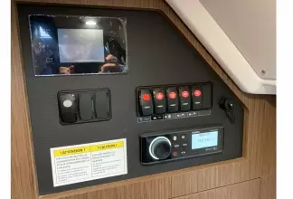 Jeanneau NC 37 twin diesel cruiser - audio controls and switch panel