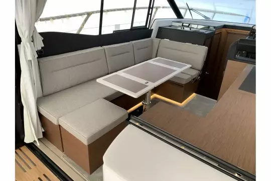 Jeanneau NC 37 twin diesel cruiser - wheelhouse saloon with U shape seating and table
