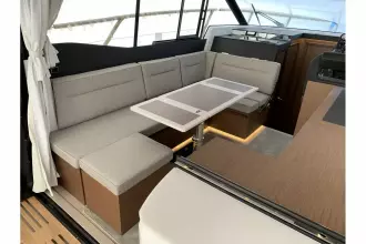 Jeanneau NC 37 twin diesel cruiser - wheelhouse saloon with U shape seating and table