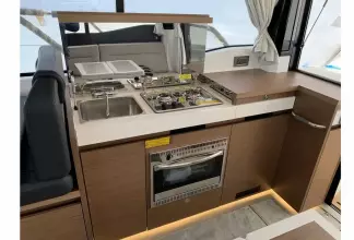 Jeanneau NC 37 twin diesel cruiser - galley with stove, oven and sink