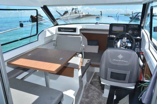Jeanneau Merry Fisher 695 wheelhouse boat - wheelhouse with port side saloon and starboard side helm position and galley
