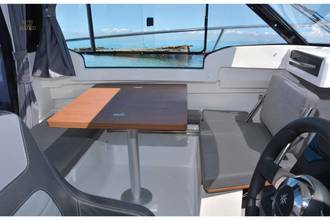 Jeanneau Merry Fisher 695 wheelhouse boat - co-pilot seat converts to seating at table