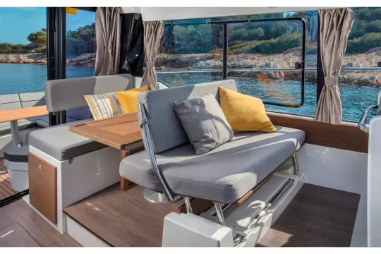 Jeanneau Merry Fisher 1095 - table folds and forward seat converts to co-pilot seat