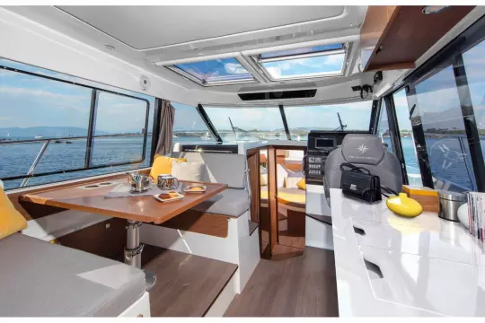 Jeanneau Merry Fisher 1095 - wheelhouse with port side seating and starboard side helm position and galley