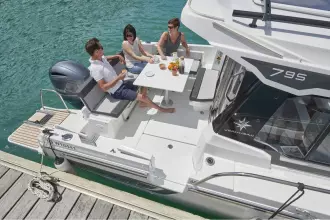 Jeanneau Merry Fisher 795 Series 2 - aft cockpit saloon with table and side gate