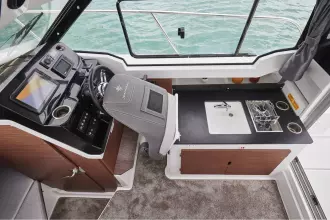 Jeanneau Merry Fisher 795 Series 2 - helm seat folds forward for easy access to galley
