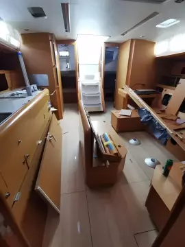 Interior of a 2017 Jeanneau Sun Odyssey 469 sailboat with wooden cabinetry.