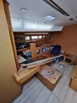 Interior of 2017 Jeanneau Sun Odyssey 469 sailboat with wooden furnishings.