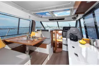 Jeanneau Merry Fisher 1095 - wheelhouse with port side seating and starboard side helm position and galley