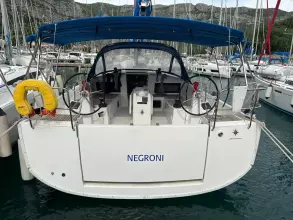 2019 Jeanneau Sun Odyssey 440 sailboat docked in marina, rear view.