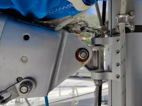 Close-up of Jeanneau Sun Odyssey 440 sailboat rigging, featuring metal fittings and blue sail cover.