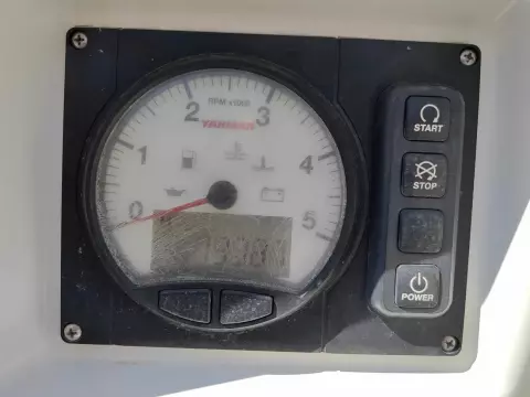 Control panel of a 2019 Jeanneau Sun Odyssey 440 sailboat with tachometer and buttons.