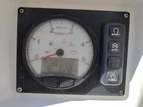 Control panel of a 2019 Jeanneau Sun Odyssey 440 sailboat with tachometer and buttons.