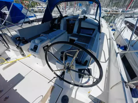 2019 Jeanneau Sun Odyssey 440 yacht cockpit with steering wheel and seating area.
