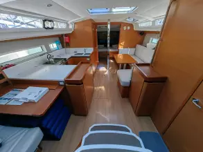 2019 Jeanneau Sun Odyssey 440 interior with modern kitchen and seating area.