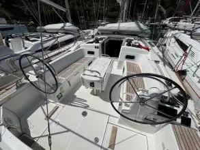 2019 Jeanneau Sun Odyssey 479 sailboat cockpit with dual steering wheels and spacious seating.