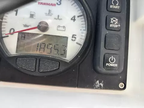 Close-up of Jeanneau Sun Odyssey 479 engine gauge, showing 1895.3 hours.