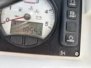 Close-up of Jeanneau Sun Odyssey 479 engine gauge, showing 1895.3 hours.