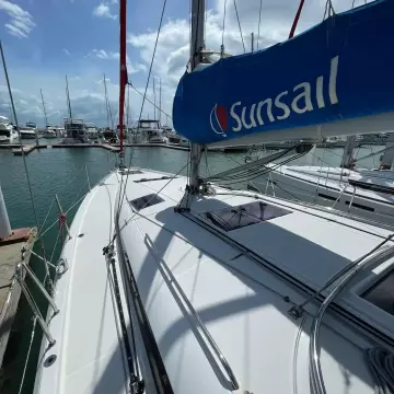 Jeanneau Sun Odyssey 440 sailboat docked at marina, featuring Sunsail branding, 2020 model.