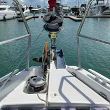Jeanneau Sun Odyssey 440 (2020) yacht bow with anchor, docked in marina.
