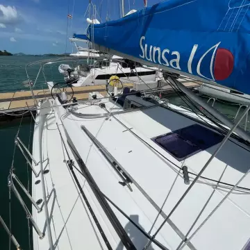 2020 Jeanneau Sun Odyssey 440 sailboat docked at marina under clear blue sky.