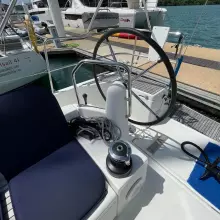 Cockpit of 2020 Jeanneau Sun Odyssey 440 sailboat with steering wheel and winch.