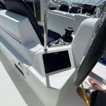 Cockpit of 2020 Jeanneau Sun Odyssey 440 sailboat with navigation equipment and steering wheel.