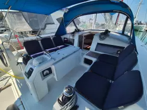 2020 Jeanneau Sun Odyssey 440 yacht cockpit with blue canopy and seating.