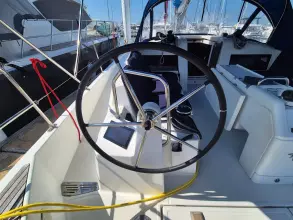 Steering wheel of 2020 Jeanneau Sun Odyssey 440 sailboat, docked in marina.
