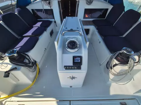 2020 Jeanneau Sun Odyssey 440 cockpit with navigation equipment and seating.