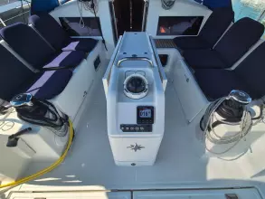 2020 Jeanneau Sun Odyssey 440 cockpit with navigation equipment and seating.
