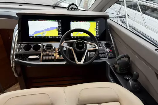 2024 Princess F50 yacht cockpit with advanced navigation displays and controls.