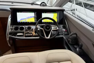 2024 Princess F50 yacht cockpit with advanced navigation displays and controls.