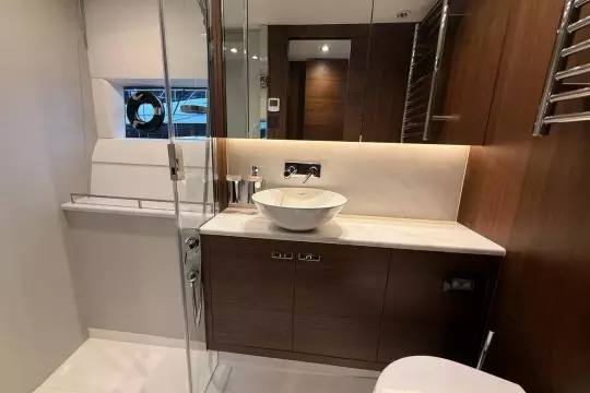 Luxurious bathroom in 2024 Princess F50 yacht with modern fixtures and elegant design.