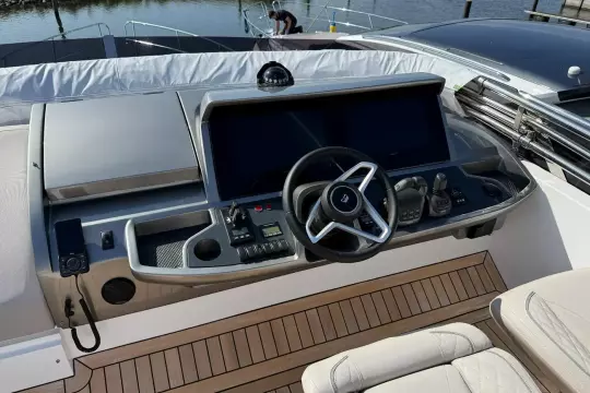 2024 Princess F50 yacht helm with modern controls and sleek design.