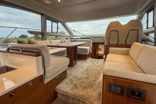 Luxurious interior of 2024 Princess F50 yacht with elegant seating and modern design.