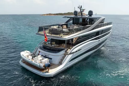 Luxurious 2023 Princess X95 yacht cruising in clear blue waters.