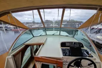 Cockpit view of 2008 Linssen 33.9 AC yacht with steering wheel and navigation equipment.
