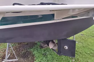 2008 Linssen 33.9 AC boat hull and propeller on grass.