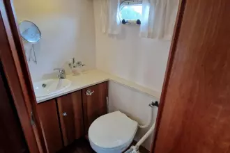 Compact bathroom in a 2008 Linssen 33.9 AC yacht, featuring a sink and toilet.