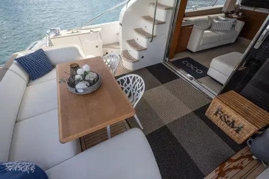 Luxurious 2015 Princess 60 yacht interior with elegant seating and stylish decor.