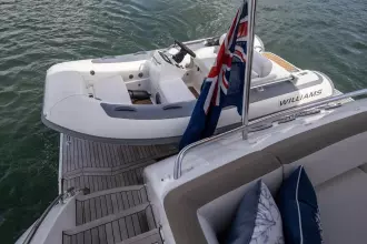 Luxury yacht Princess 60 (2015) with Williams tender and flag on deck.