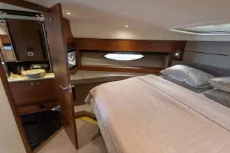 Luxurious bedroom interior of 2015 Princess 60 yacht with ensuite bathroom.