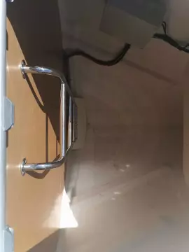 Interior view of 2013 Jeanneau Sun Odyssey 469 sailboat, featuring a metal handle and wiring.