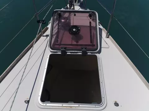 Open hatch on 2013 Jeanneau Sun Odyssey 469 sailboat deck, showing interior access.