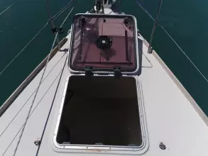 Open hatch on 2013 Jeanneau Sun Odyssey 469 sailboat deck, showing interior access.