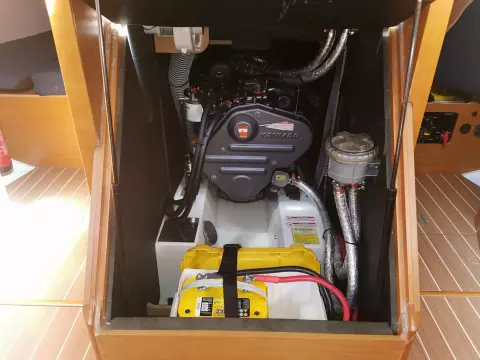Engine compartment of 2013 Jeanneau Sun Odyssey 469 sailboat, featuring Yanmar engine and battery.