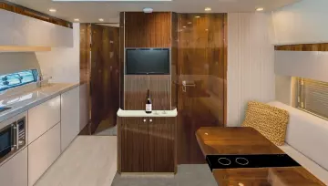 Luxurious interior of 2025 Fairline Targa 50 Open yacht with modern kitchen and dining area.