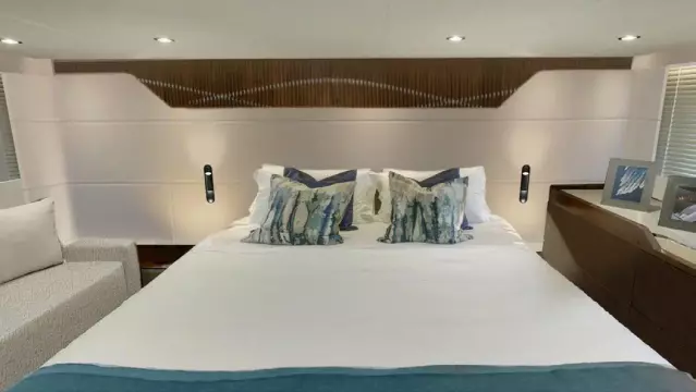 Luxurious bedroom interior of 2025 Fairline Targa 50 Open yacht with modern decor.