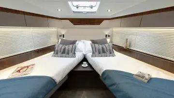 Luxurious cabin interior of 2025 Fairline Targa 50 Open yacht with twin beds.